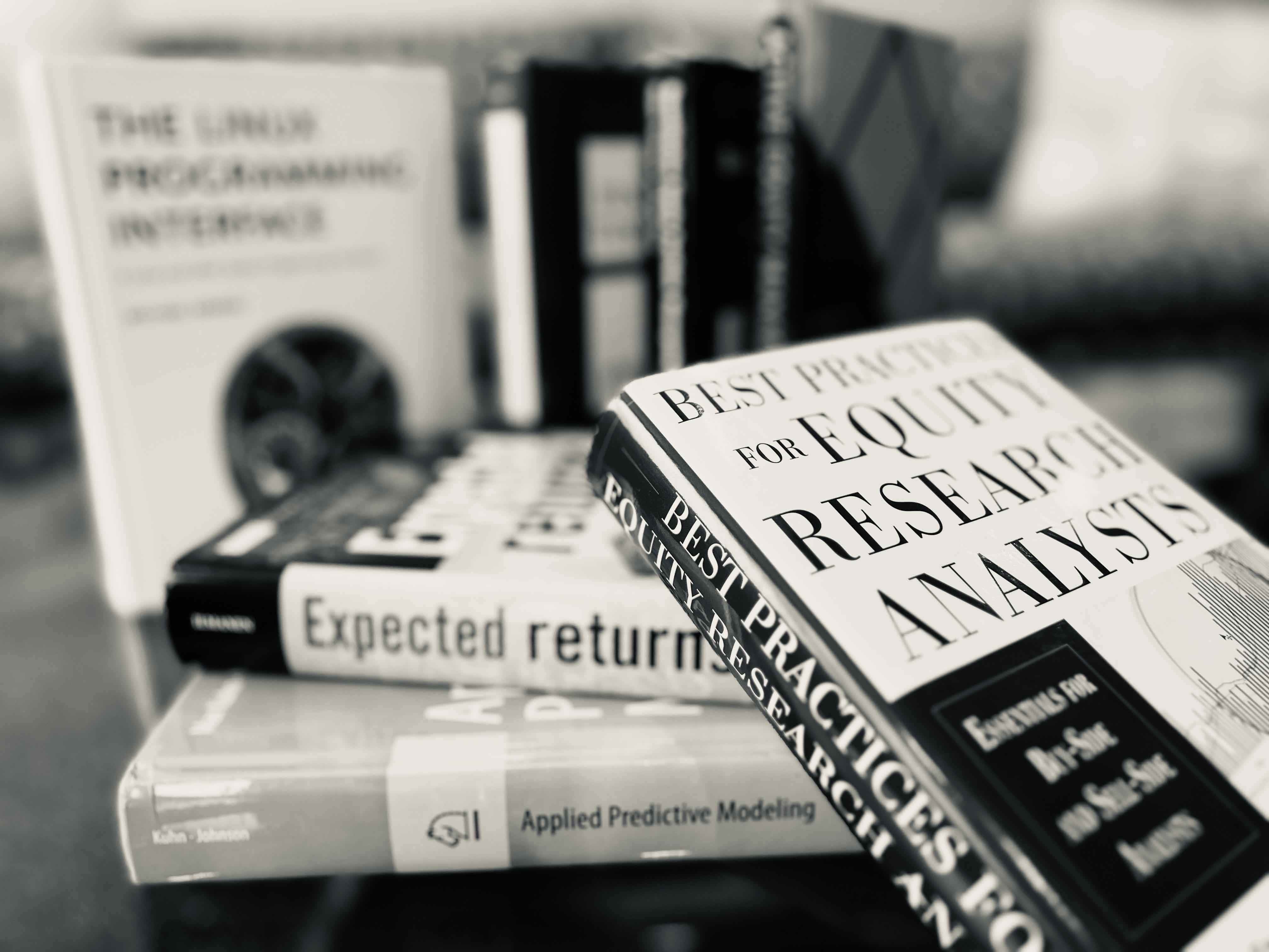 image of books used in quantitaive work, including finanance, statistics and coding